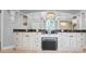 Bright bathroom with a long vanity with cabinets and a large, well-lit mirror at 10712 Pontofino Cir, Trinity, FL 34655
