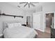 Spacious bedroom with natural light, neutral colors, ceiling fan and an ensuite bathroom at 10712 Pontofino Cir, Trinity, FL 34655