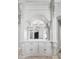 Ornate built-in cabinet with a decorative mirror and exquisite architectural millwork at 10712 Pontofino Cir, Trinity, FL 34655