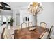 Formal dining room features an elegant chandelier and decorative architectural details for sophisticated entertaining at 10712 Pontofino Cir, Trinity, FL 34655