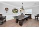 Spacious game room featuring a ping pong table, decorative artwork, and stylish furnishings for entertainment at 10712 Pontofino Cir, Trinity, FL 34655