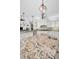 Gourmet kitchen features a center island with granite countertops, custom cabinets, and stainless steel appliances at 10712 Pontofino Cir, Trinity, FL 34655