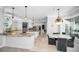 Open-concept kitchen with custom cabinetry, granite countertops, and a breakfast nook with backyard views at 10712 Pontofino Cir, Trinity, FL 34655