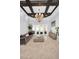 Spacious living room features elegant chandelier, comfortable seating, and a view of the outdoor area at 10712 Pontofino Cir, Trinity, FL 34655