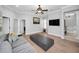 Spacious living room with gray sofa, dark coffee table, and doors leading to other rooms at 10712 Pontofino Cir, Trinity, FL 34655