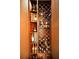 Custom-built wine rack showcases an extensive collection of bottles in a stylish and organized display at 10712 Pontofino Cir, Trinity, FL 34655