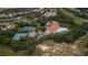 Stunning aerial view of community pool and tennis courts at 11253 Avalon Way, Spring Hill, FL 34609