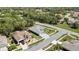 A beautiful aerial view displays a comfortable home in a leafy neighborhood setting at 11253 Avalon Way, Spring Hill, FL 34609
