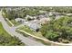 An elevated view displaying a cozy home nestled in a well-kept neighborhood with tree-lined streets at 11253 Avalon Way, Spring Hill, FL 34609