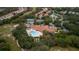 Excellent aerial view of community pool, clubhouse, tennis courts and walking path at 11253 Avalon Way, Spring Hill, FL 34609
