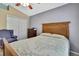 Comfortable bedroom featuring a closet, wooden furniture, and soft, natural lighting at 11253 Avalon Way, Spring Hill, FL 34609