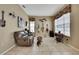 Cozy room featuring a sofa, guitars, and a vintage sewing table at 11253 Avalon Way, Spring Hill, FL 34609