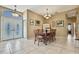 Elegant dining room with a vintage table set and decorative lighting fixtures at 11253 Avalon Way, Spring Hill, FL 34609