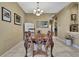 Elegant dining room with a vintage table set and decorative lighting fixtures at 11253 Avalon Way, Spring Hill, FL 34609