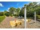 Dog park featuring wood chip ground cover, a unique grooming station, and seating for pet owners at 11253 Avalon Way, Spring Hill, FL 34609