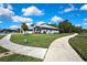 Charming single-story home with manicured lawn, mature trees, and inviting curb appeal at 11253 Avalon Way, Spring Hill, FL 34609
