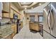 Well-lit kitchen featuring granite countertops, stainless steel appliances, and custom cabinetry at 11253 Avalon Way, Spring Hill, FL 34609