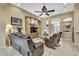 Spacious living room with tile flooring, archways, and natural lighting at 11253 Avalon Way, Spring Hill, FL 34609