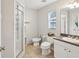 Well-lit bathroom featuring a walk-in shower and a bidet at 11630 Pasadena Rd, Dade City, FL 33525