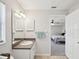 Bathroom with single sink vanity and access to the bedroom at 11630 Pasadena Rd, Dade City, FL 33525