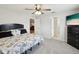 Carpeted bedroom featuring a queen bed and an open doorway at 11630 Pasadena Rd, Dade City, FL 33525