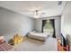 Bright bedroom with a window view and carpet flooring at 11630 Pasadena Rd, Dade City, FL 33525