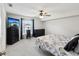 Bedroom with neutral tones, plush carpet, and large window at 11630 Pasadena Rd, Dade City, FL 33525