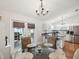 Bright dining area leading to kitchen, with sliding glass doors to the backyard at 11630 Pasadena Rd, Dade City, FL 33525