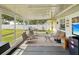 Screened patio offering outdoor seating with direct view of backyard at 11630 Pasadena Rd, Dade City, FL 33525