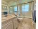 Clean bathroom featuring a shower-tub combination and a single sink vanity at 11814 Carissa Ln, New Port Richey, FL 34654