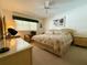Relaxing bedroom with a ceiling fan and a neutral color palette at 11814 Carissa Ln, New Port Richey, FL 34654