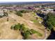 Scenic aerial view of the golf course with ponds and green spaces, highlighting the community's recreational amenities at 11814 Carissa Ln, New Port Richey, FL 34654