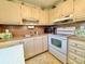 Efficient kitchen features a microwave, stove, and plenty of storage space at 11814 Carissa Ln, New Port Richey, FL 34654