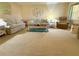 Comfortable living room with plush carpeting and neutral-toned furniture at 11814 Carissa Ln, New Port Richey, FL 34654