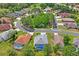 This aerial view shows the backyard pool and landscaping of the home at 11949 Wexford Blvd, Spring Hill, FL 34609