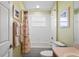 Bright bathroom featuring a tiled shower and tub combination, enhanced by natural light from the window at 11949 Wexford Blvd, Spring Hill, FL 34609