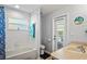 Bathroom with a toilet, a vanity, a shower, a towel, and an exit door to the pool at 11949 Wexford Blvd, Spring Hill, FL 34609