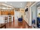Dining area with wood floors, and sliding glass doors providing abundant natural light and patio views at 11949 Wexford Blvd, Spring Hill, FL 34609