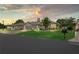 Serene sunset view of a well-kept home with a lush front lawn and mailbox at 11949 Wexford Blvd, Spring Hill, FL 34609