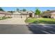 Beautiful single-story home with a three-car garage and lush green lawn at 11949 Wexford Blvd, Spring Hill, FL 34609