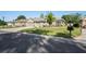 Single-story home on a quiet street with a well-maintained lawn, three-car garage, and landscaped front yard at 11949 Wexford Blvd, Spring Hill, FL 34609