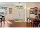 Inviting foyer with hardwood floors, a high ceiling, and a view of the front door at 11949 Wexford Blvd, Spring Hill, FL 34609