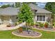 A well-manicured front yard with a decorative tree and custom landscaping at 11949 Wexford Blvd, Spring Hill, FL 34609