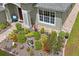 Landscaped front yard with brick walkway leading to the home's entrance and beautiful curb appeal at 11949 Wexford Blvd, Spring Hill, FL 34609