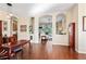 Open living space with hardwood floors and arched entryways leading to other rooms at 11949 Wexford Blvd, Spring Hill, FL 34609