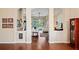 Bright living room with hardwood floors, arched entryways, and views of the pool at 11949 Wexford Blvd, Spring Hill, FL 34609
