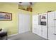 This living room features a light-green wall, a closet, a cabinet, and patterned flooring at 11949 Wexford Blvd, Spring Hill, FL 34609