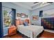 Primary suite features a ceiling fan, tray ceiling, ensuite bathroom and hardwood floors at 11949 Wexford Blvd, Spring Hill, FL 34609