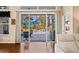 An amazing outdoor living space that boasts a beautiful pool and patio area with sliding glass doors at 11949 Wexford Blvd, Spring Hill, FL 34609