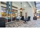 Covered lanai with comfortable seating overlooking a screened-in pool area, designed for relaxation and entertainment at 11949 Wexford Blvd, Spring Hill, FL 34609